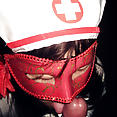 Japanese girl in kinky nurse costume - image 