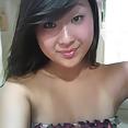 Japanese wife Eriko spreads leg to show pussy - image 