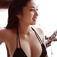 Busty teen idol Saaya Irie at the beach in her sexy bikini - image 