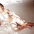 Busty teen idol Saaya Irie at the beach in her sexy bikini - image 