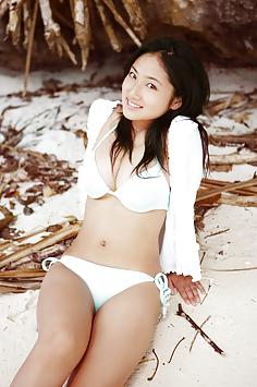 Busty teen idol Saaya Irie at the beach in her sexy bikini
