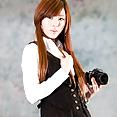 Hwang Mi Hee with her Nikon Canon camera - image 