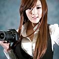 Hwang Mi Hee with her Nikon Canon camera - image 