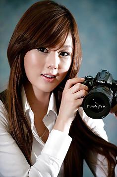 Hwang Mi Hee with her Nikon Canon camera